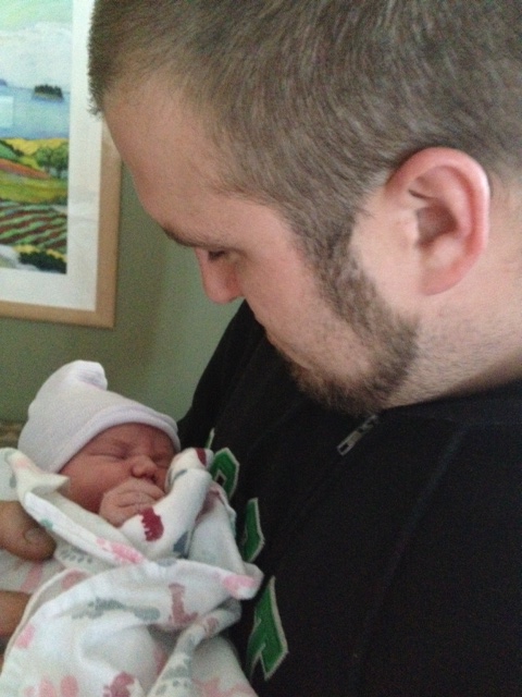 Dan with baby Charlotte...already a pro