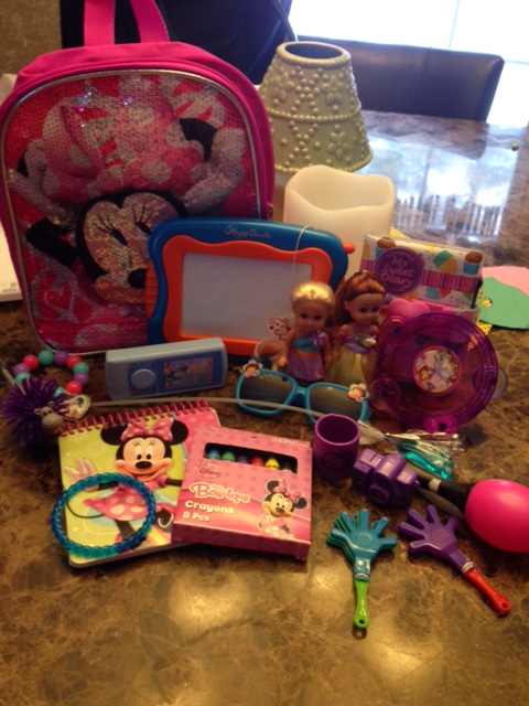 A backpack full of "sensory toys" that Melissa purchased and packed for Mia to help her on our flight to Florida on our family vacation. 